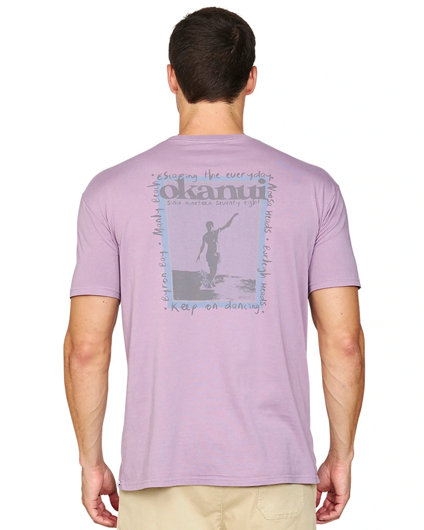A closer back view of the Okanui Zine T-Shirt in Washed Lilac featuring the back print.