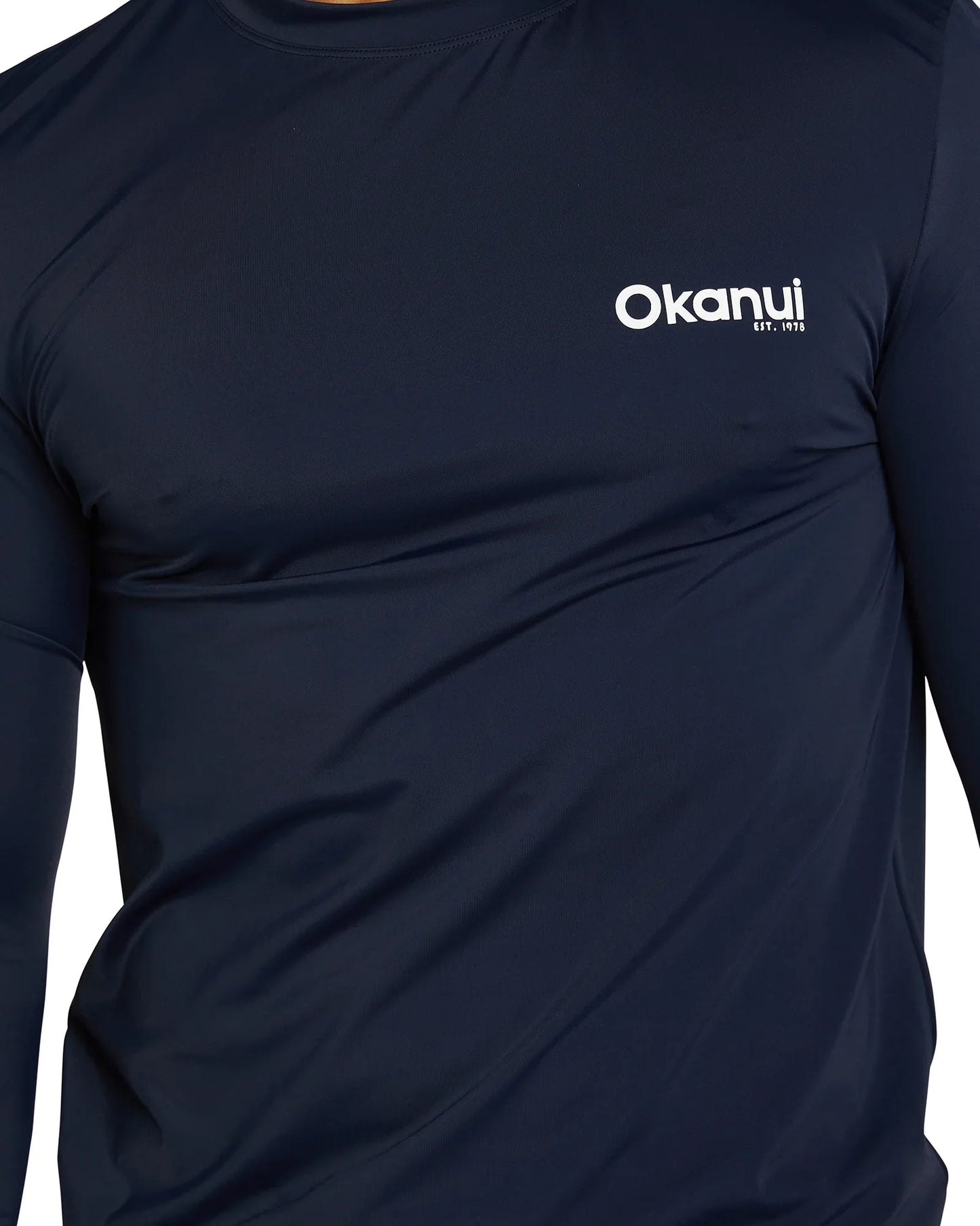 Closer details of Okanui Men's Spring Long Sleeve Rashie in navy.