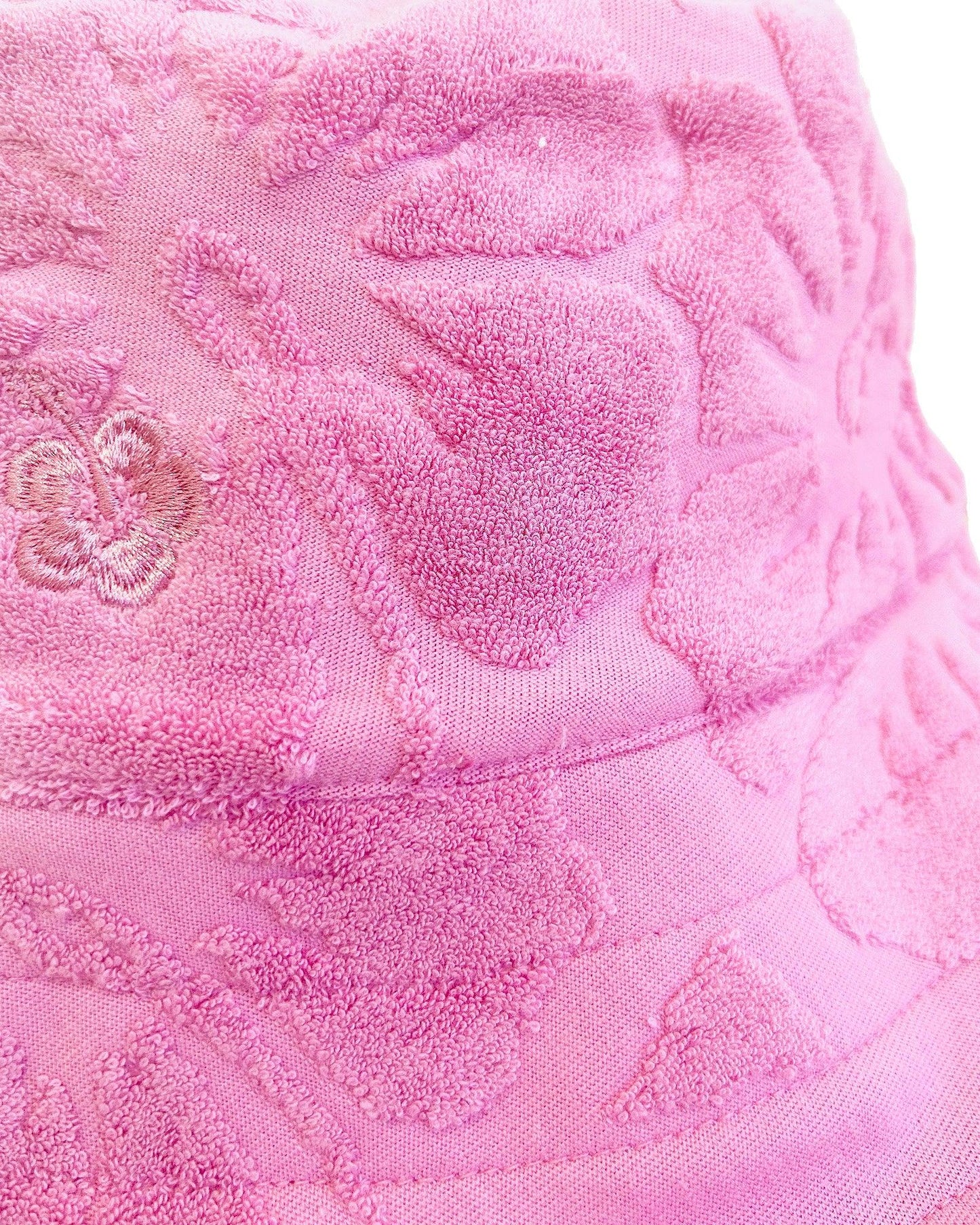 Close up details of the Okanui Weekender Terry Adult bucket hat in Hibiscus Pink