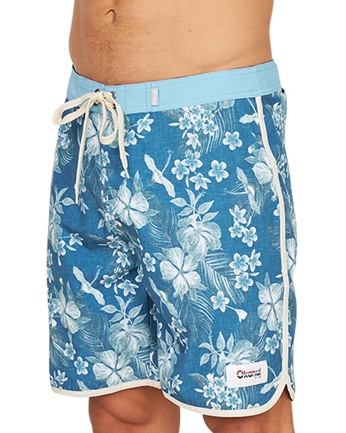 A close up side view of the Okanui Tropic Shores Retro Boardrider Boardshort in Teal.