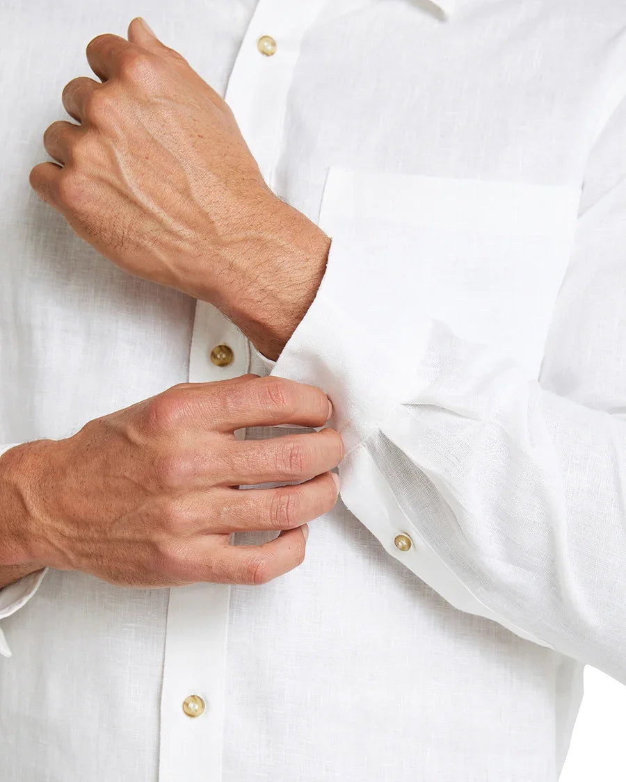 Closer look of Okanui white button up long sleeves featuring it's buttons and linen fabric.