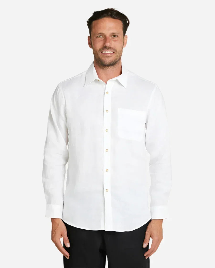A man wearing a white Okanui's linen button up long sleeve shirt.