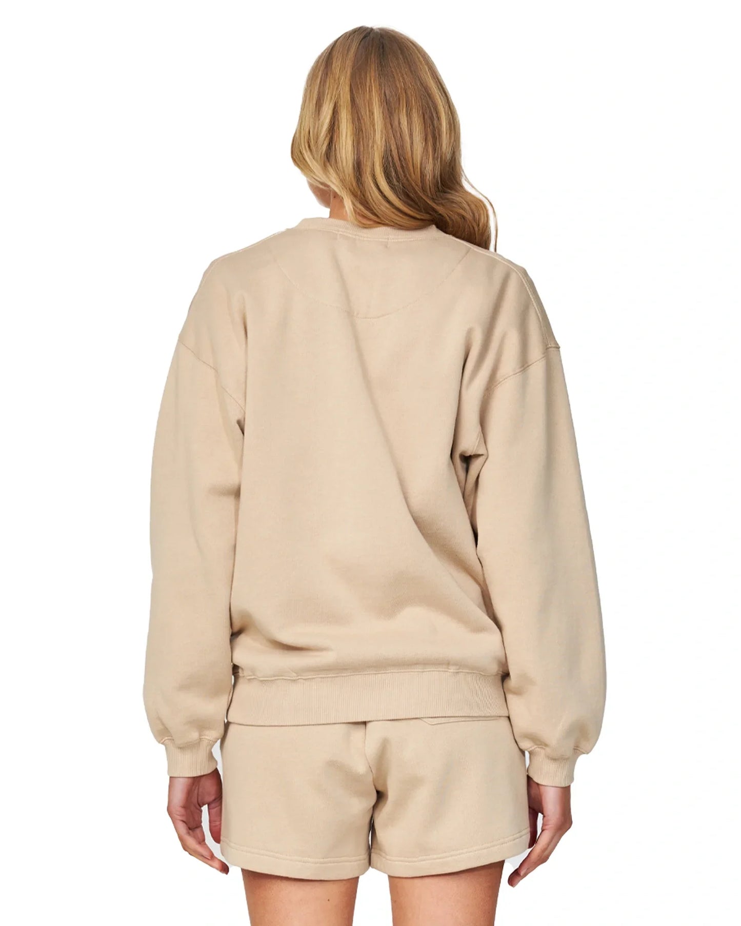 Womens winter fleece and short in Warm sand-colored showing the back view.