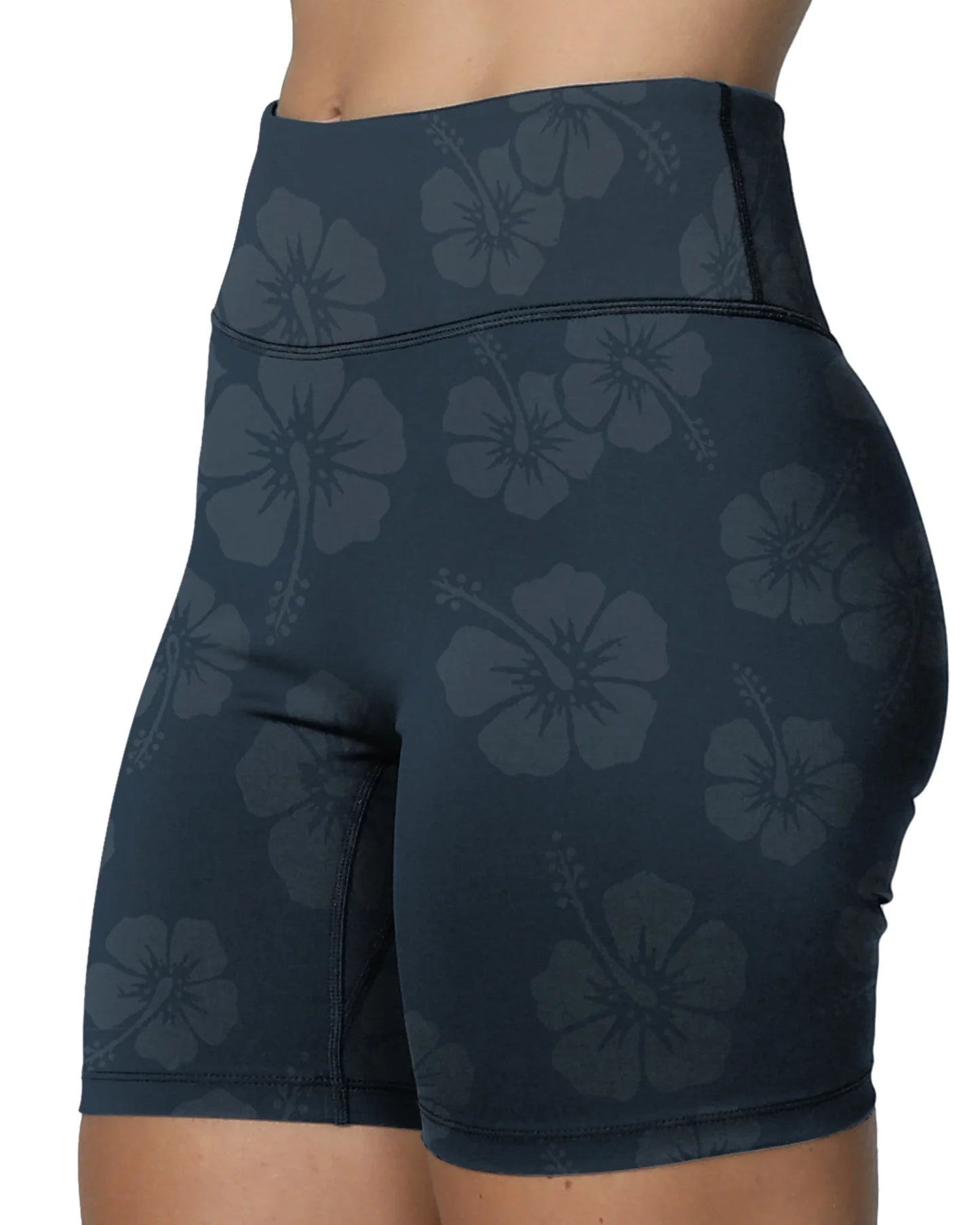 Left side view of the Okanui active bike shorts in tonal hibiscus navy color