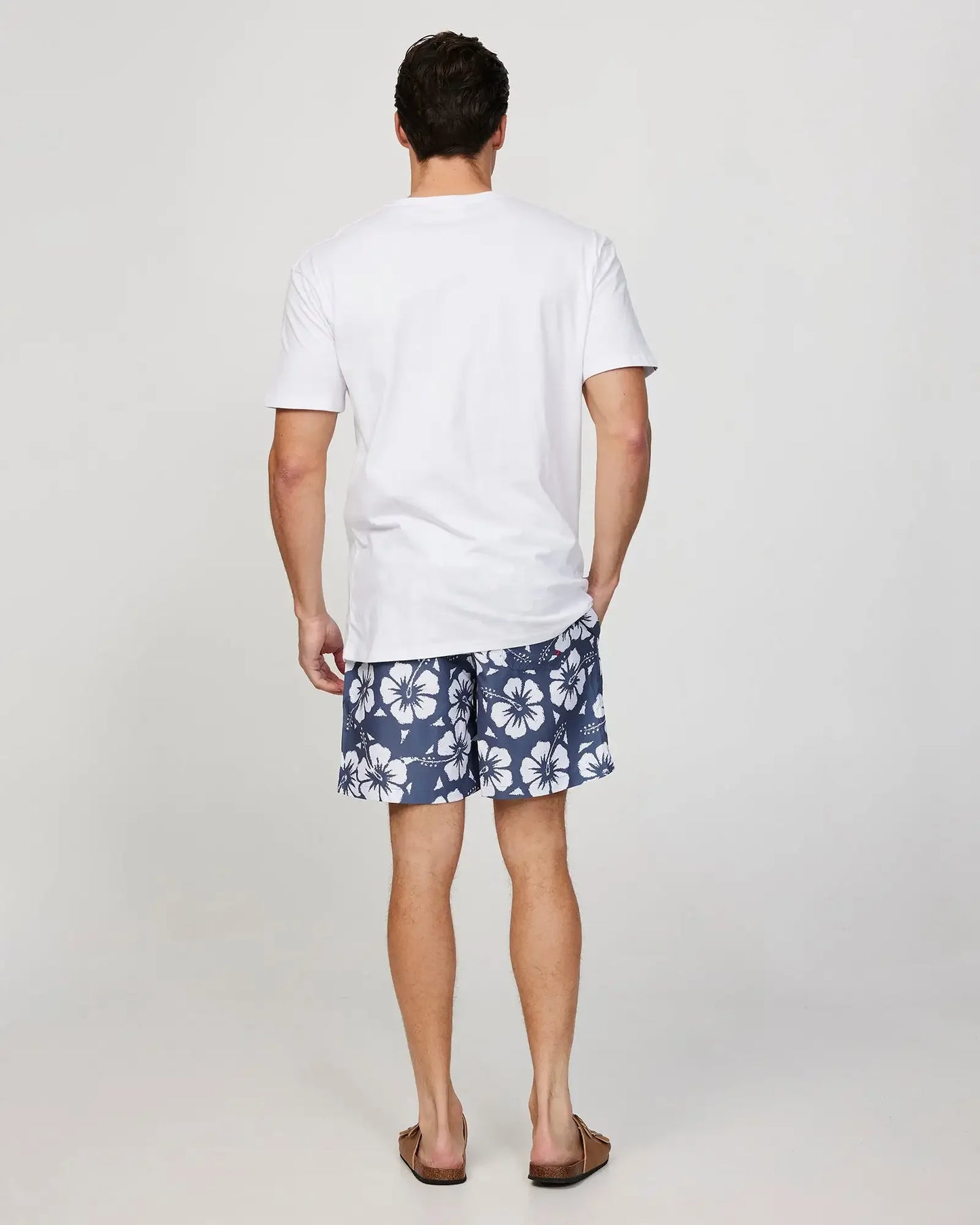 Full body front view of a male model wearing the Okanui Mens T-Shirt Destination Tee in White
