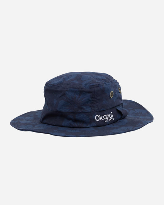 The Okanui Boonie Bucket Hat in navy color with subtle Hibiscus flower prints in white background.