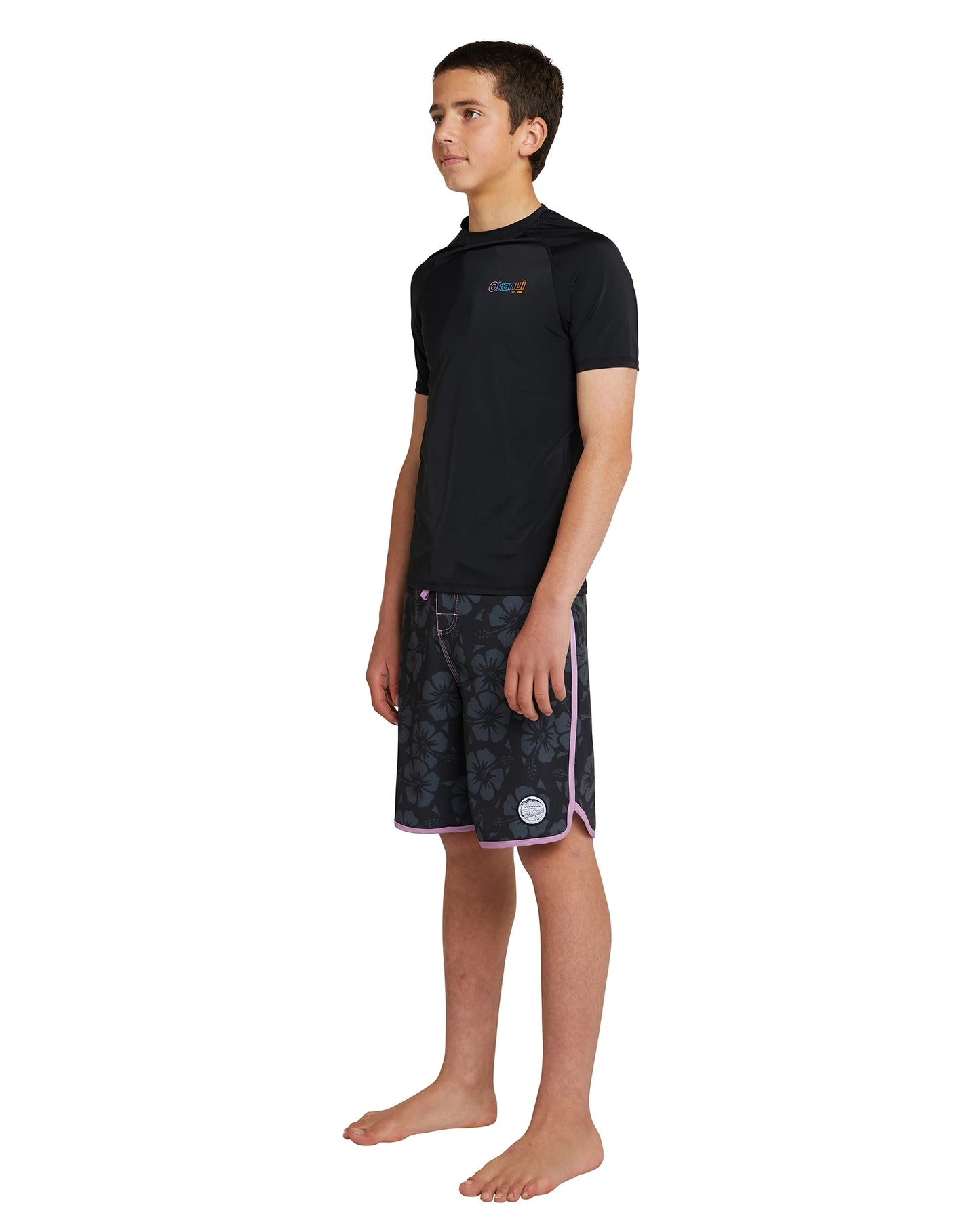 The Okanui Boy's Spring Short Sleeve Rashie in black side view. 