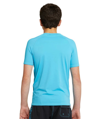 Back view showing the Okanui Boy's spring short sleeve rashie in storm blue.