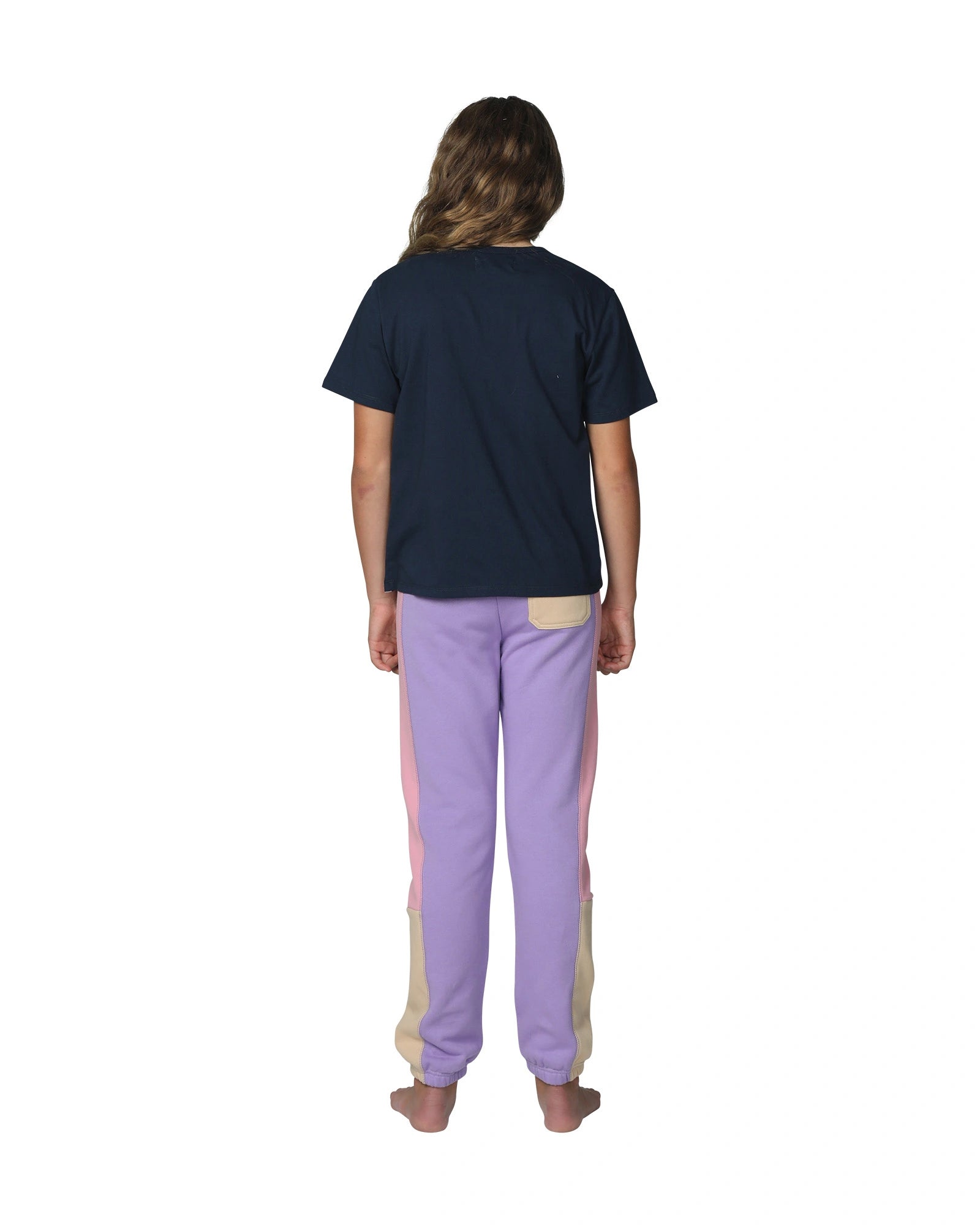 Girls trackpants in pink, yellow and lilac color with navy blue top showing the back view part. 