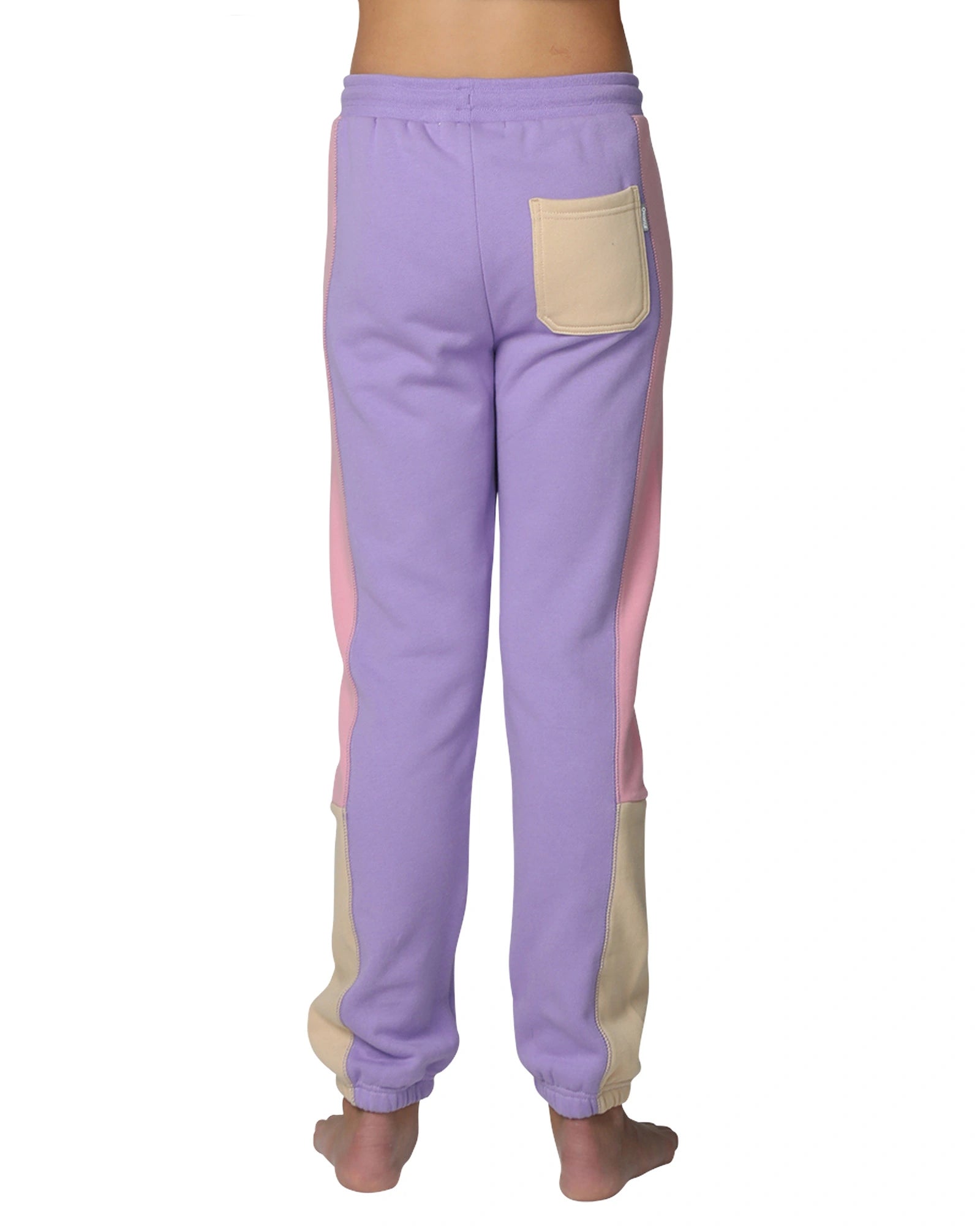 Okanui Girls trackpants in multi-colors showing the back pocket in color yellow. 