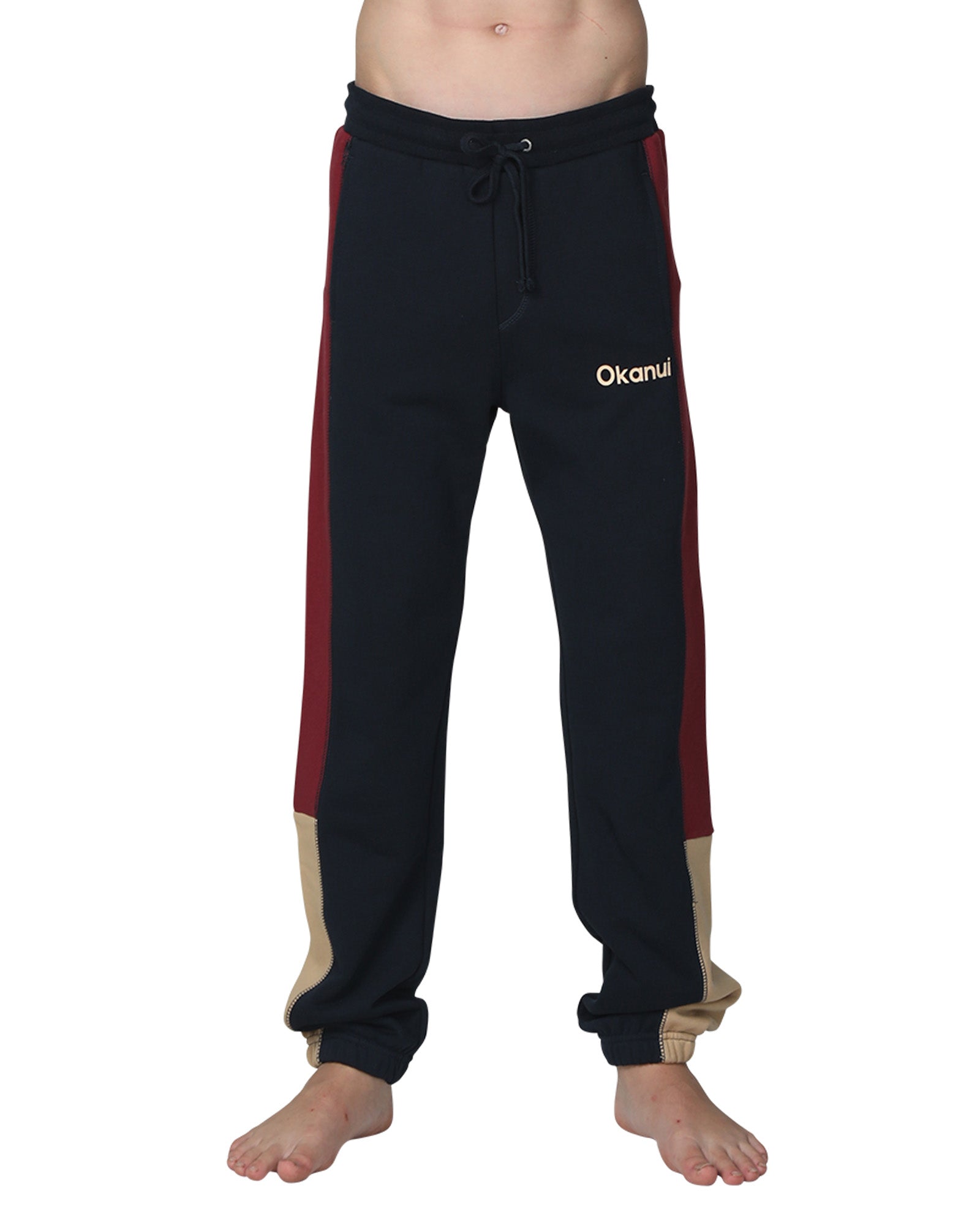 Front view of the Okanui Boys Track pants trackies in Navy Multi