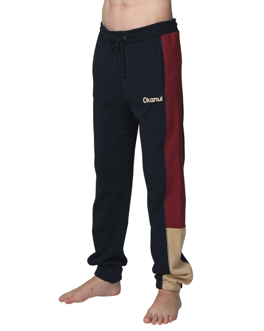 Closeup front view of the Okanui Boys Track pants trackies in Navy Multi