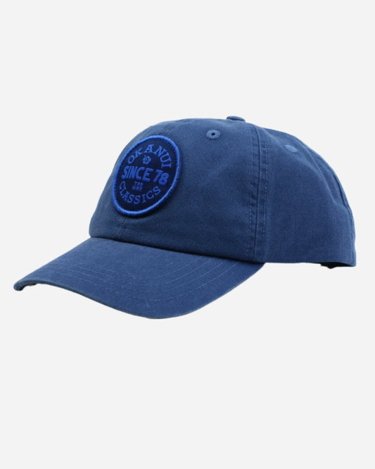 Front view of the Okanui Kids Stamp Trucker Cap in Navy