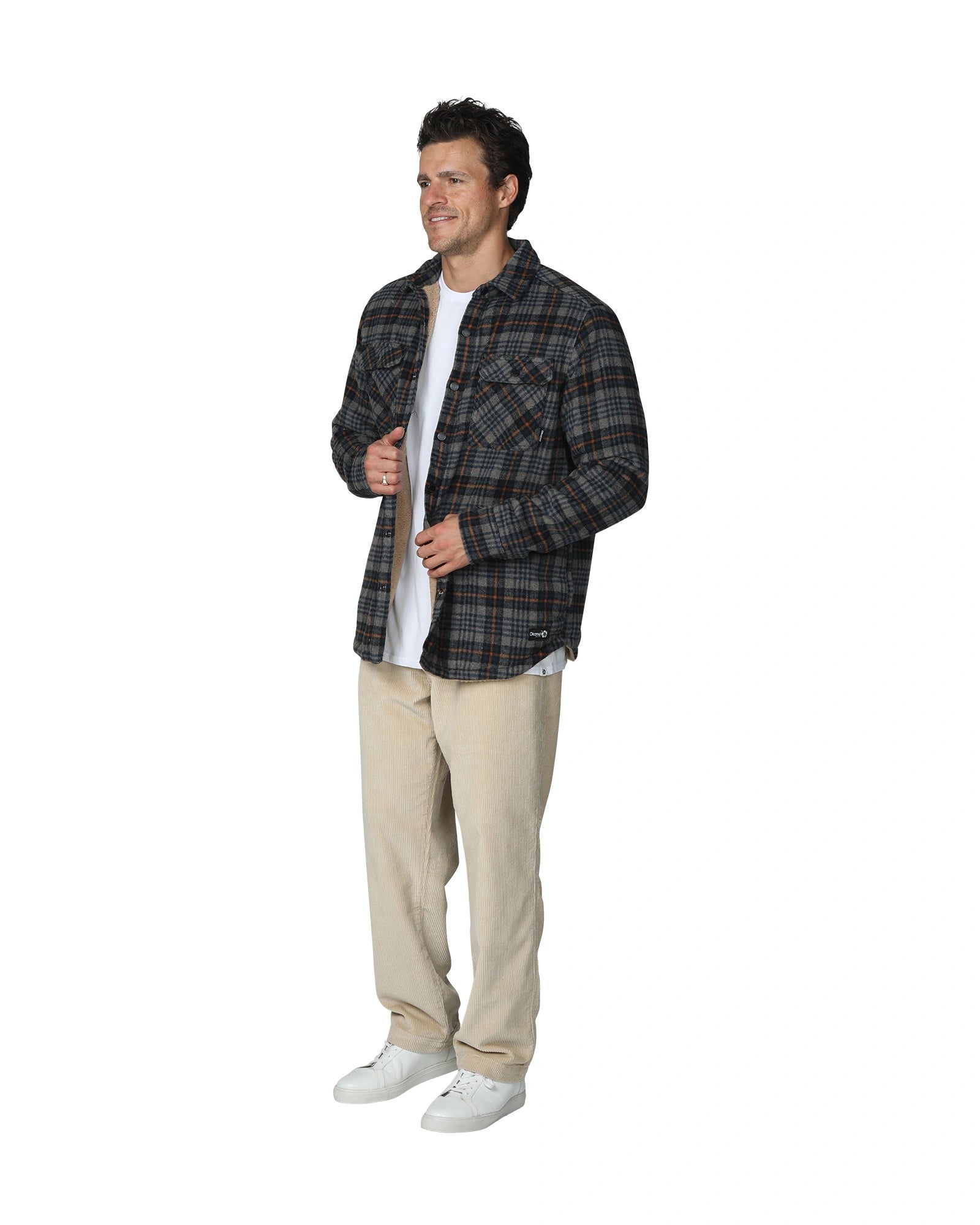 Checkered winter jacket with beige color pants showing the side view.