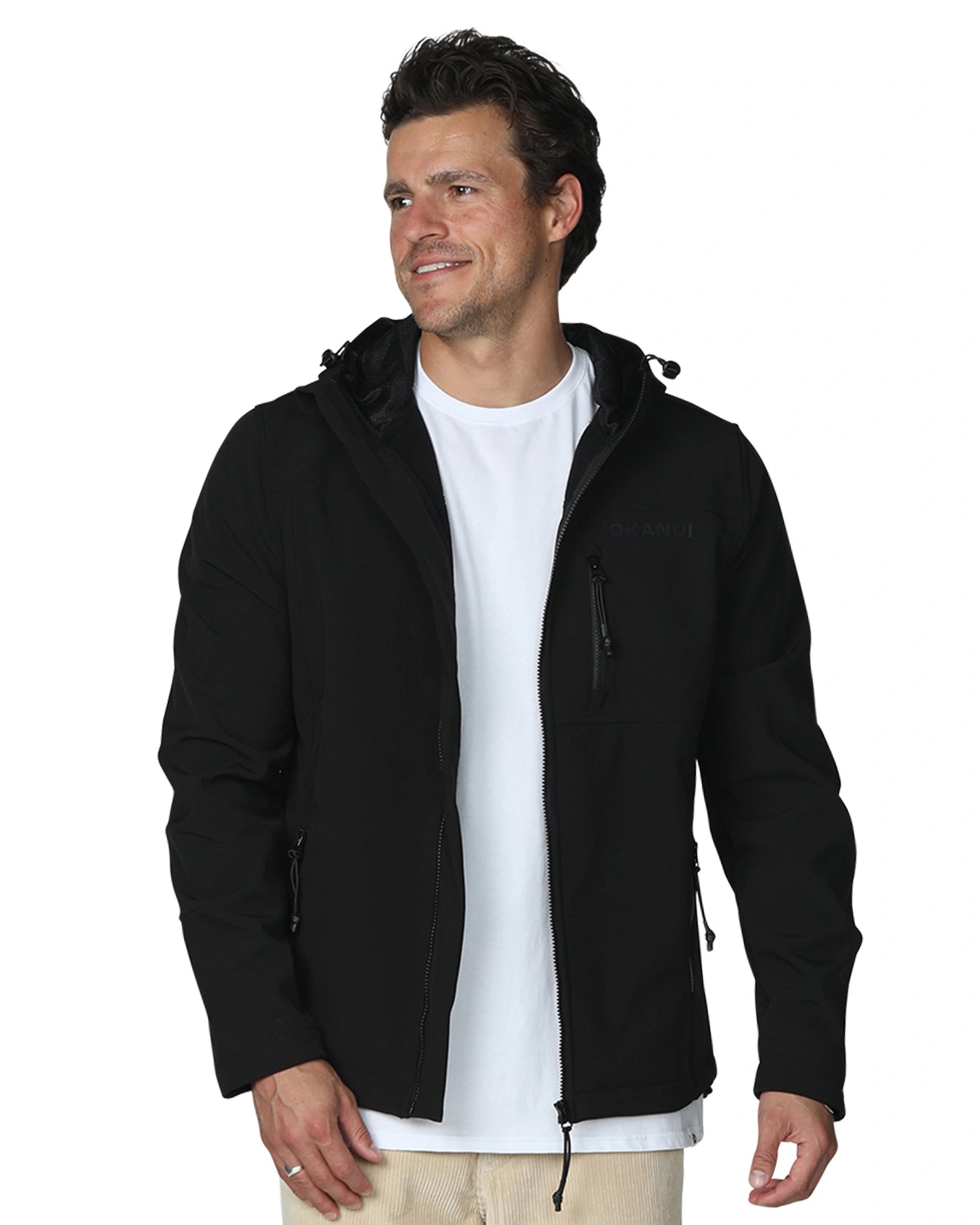 Mens soft shell jacket in color black with white shirt inside. 