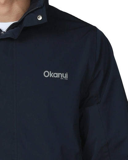 Mens surf jacket in navy blue color with Okanui logo in the chest. 