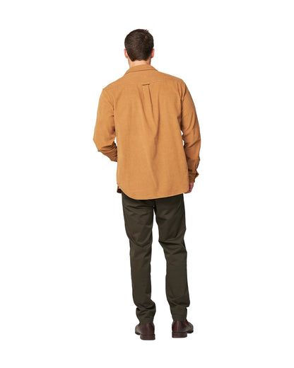 Full back view of a male model wearing the Okanui Corduroy Ledge Long Sleeve Shirt in Sand colour.