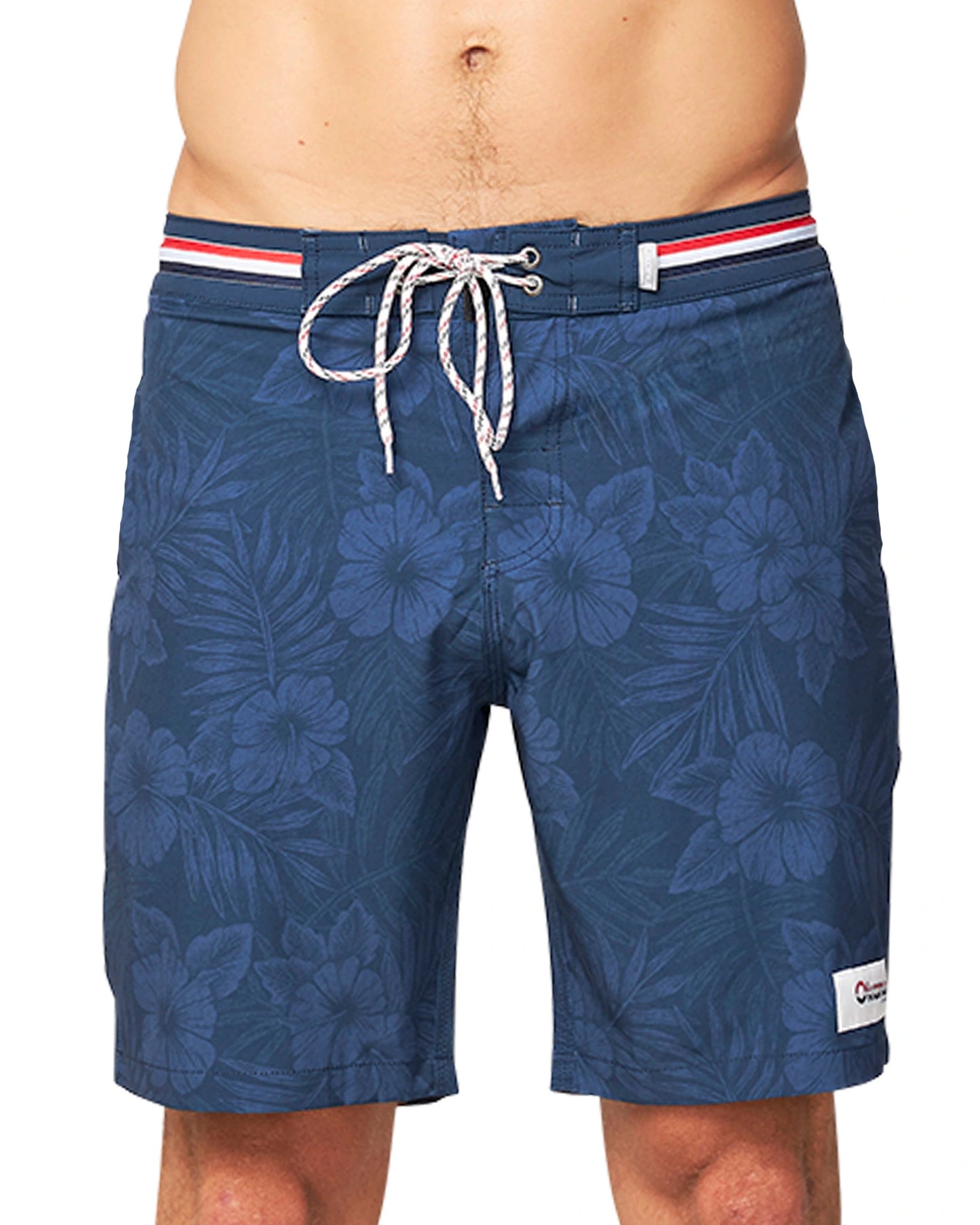 A close up front view of the Okanui Midnight Jungle Boardrider Boardshort in navy color.