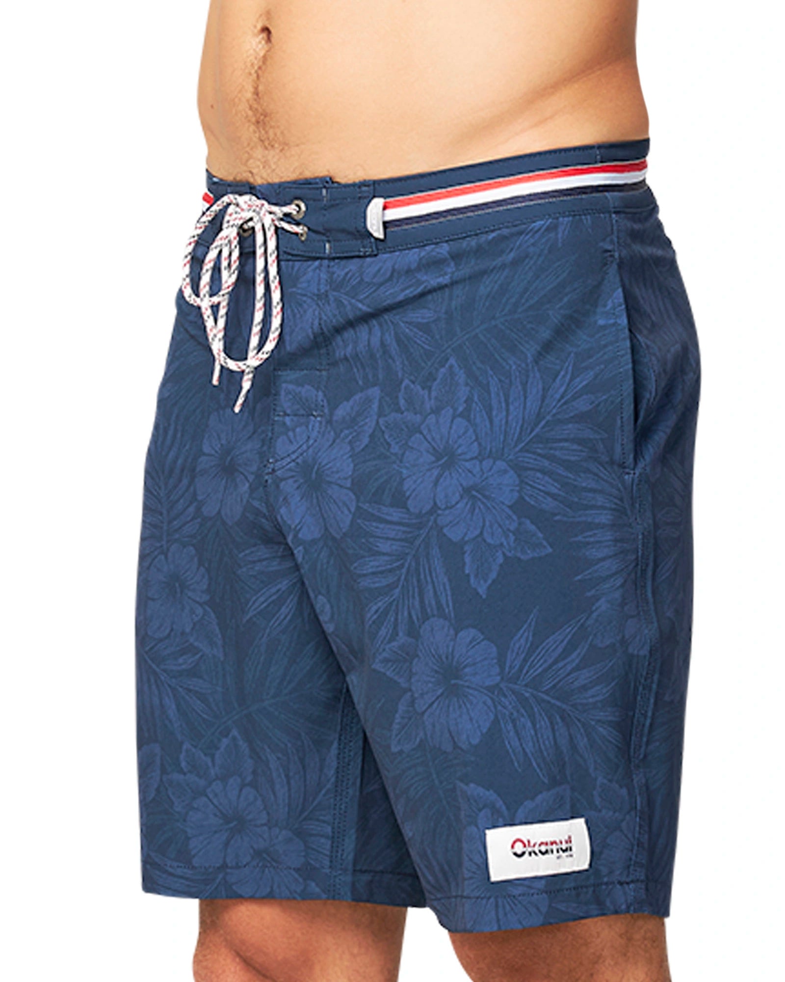 A close up side view of the Okanui Midnight Jungle Boardrider Boardshort in navy color.