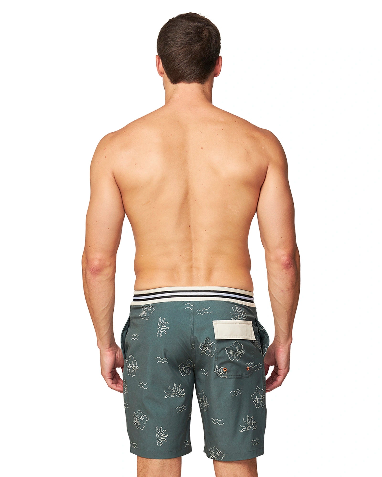 Back view of a male shirtless model wearing the Okanui Rising Sun Boardrider Boardshort in Forest color