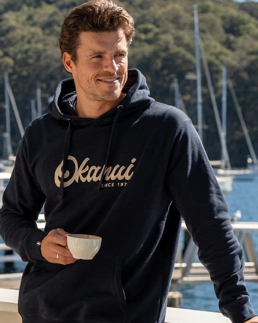 Navy, blue-colored hoodie with Okanui logo in the center. 