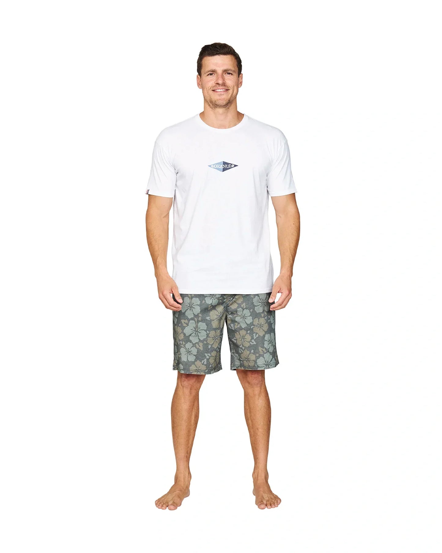 A full body front view of a model wearing the Okanui Stonewall Heritage Walk Short in Forest colour.