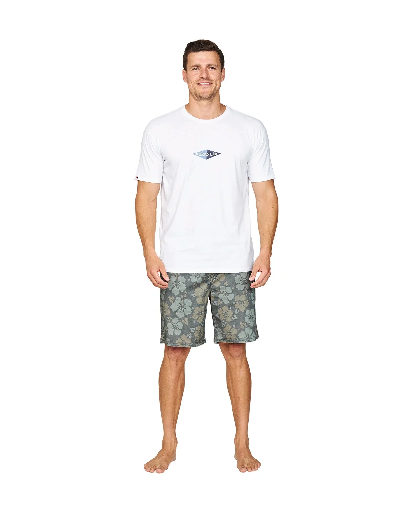 A full body front view of a model wearing the Okanui Stonewall Heritage Walk Short in Forest colour.