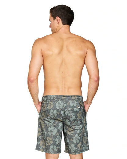 Back view of a shirtless male model with his hands in the pockets of the Okanui Stonewall Heritage Walk Short in Forest colour.
