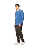 A side view of a male model wearing the Okanui Anchor Knit in Blue Marle color.