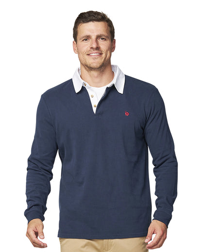 A front view of a male model wearing the Okanui 1st XV Heritage Rugby Top in Navy colour.