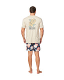 Back view of a male model wearing a birch t-shirt showcasing the back print and the Okanui Way Back When Stretch Swim Short in Navy Cedar colour.