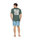 Back view of a man wearing a green t-shirt and the Okanui Sketch Stretch Swim Shorts in Steel Stone colour.