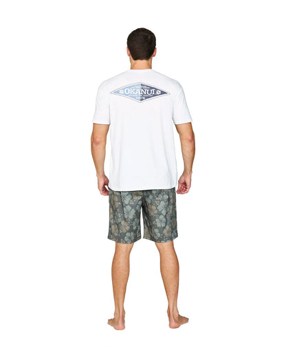 Back view of a male model wearing the Okanui Cornerstone T-shirt in white colour featuring a back print.