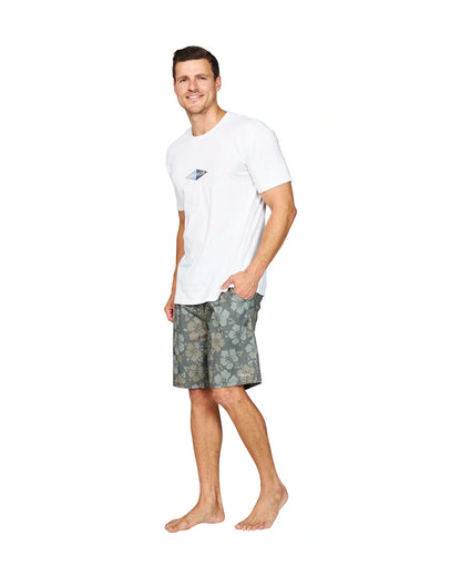 A male model casually posing wearing the Okanui Cornerstone T-shirt in white colour.