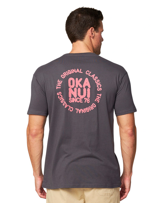 The back of the Okanui Stand Up Tee in Iron colour.