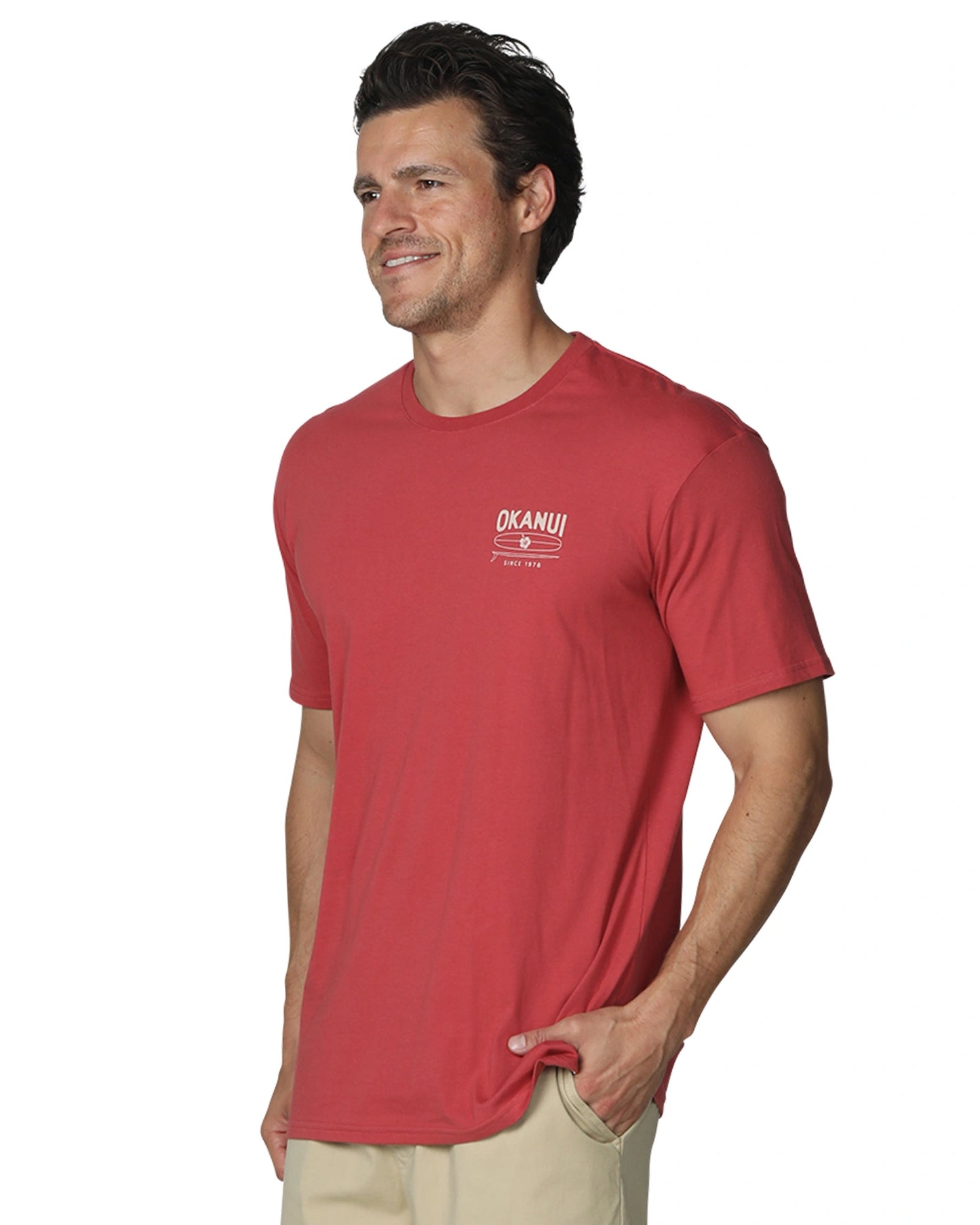 A slightly side view of a male model wearing Okanui's Boardriders Men's T-Shirt in Rust colour.