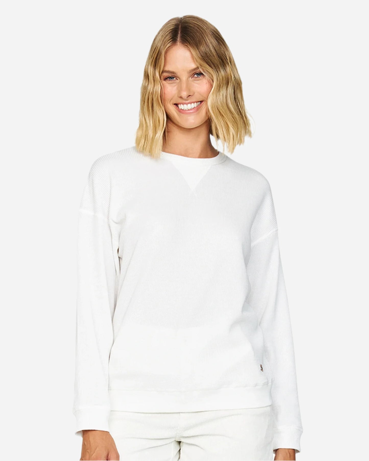 Front view of the Okanui long sleeve waffle knit jumper in white color