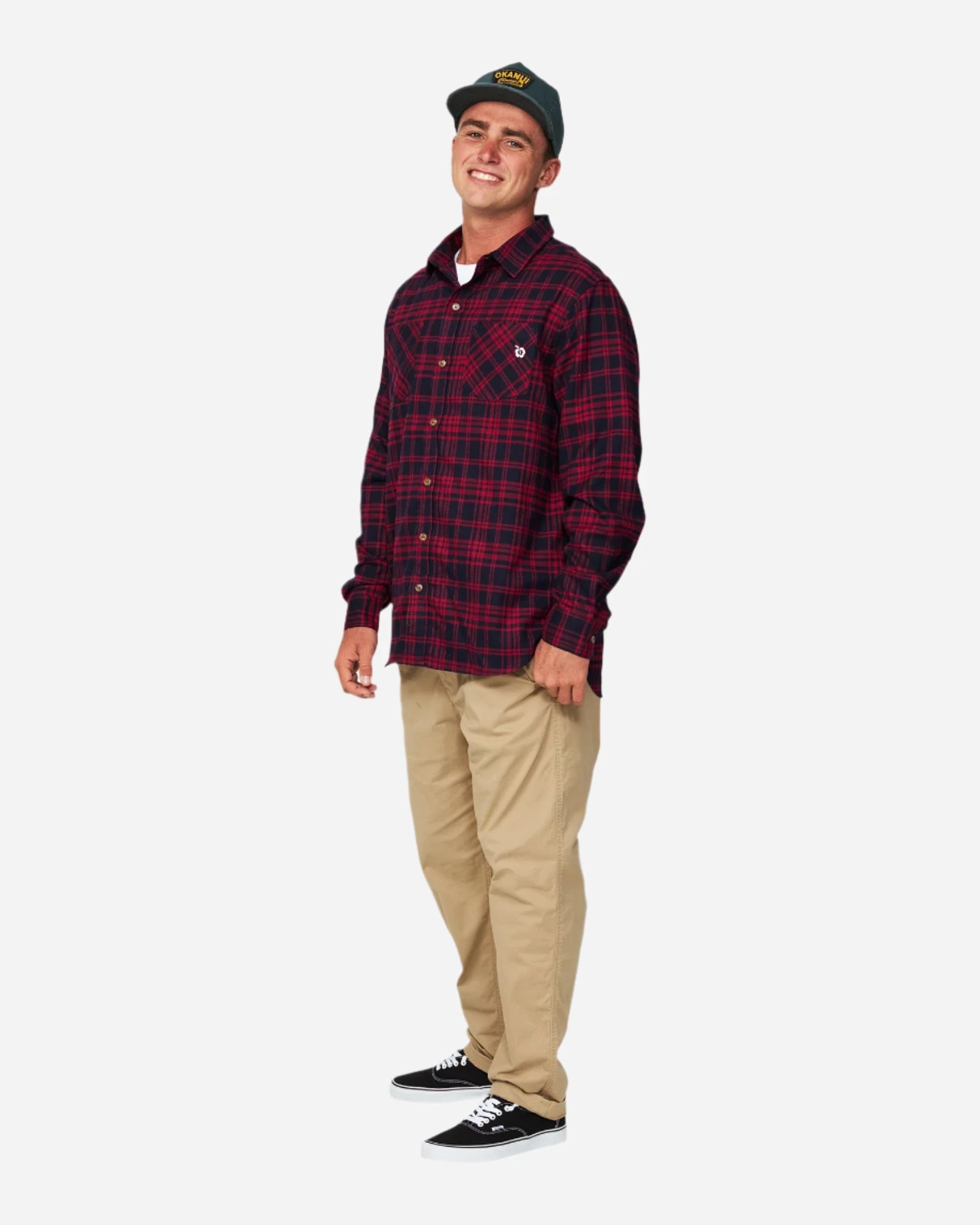 The Okanui Long Sleeve Flannel Hiker Shirt worn with a cap, khaki pants and shoes.