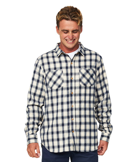 A closer view of the Okanui Long Sleeve Flannel Shirt featuring its two chest pockets contradicting the shirts pattern.