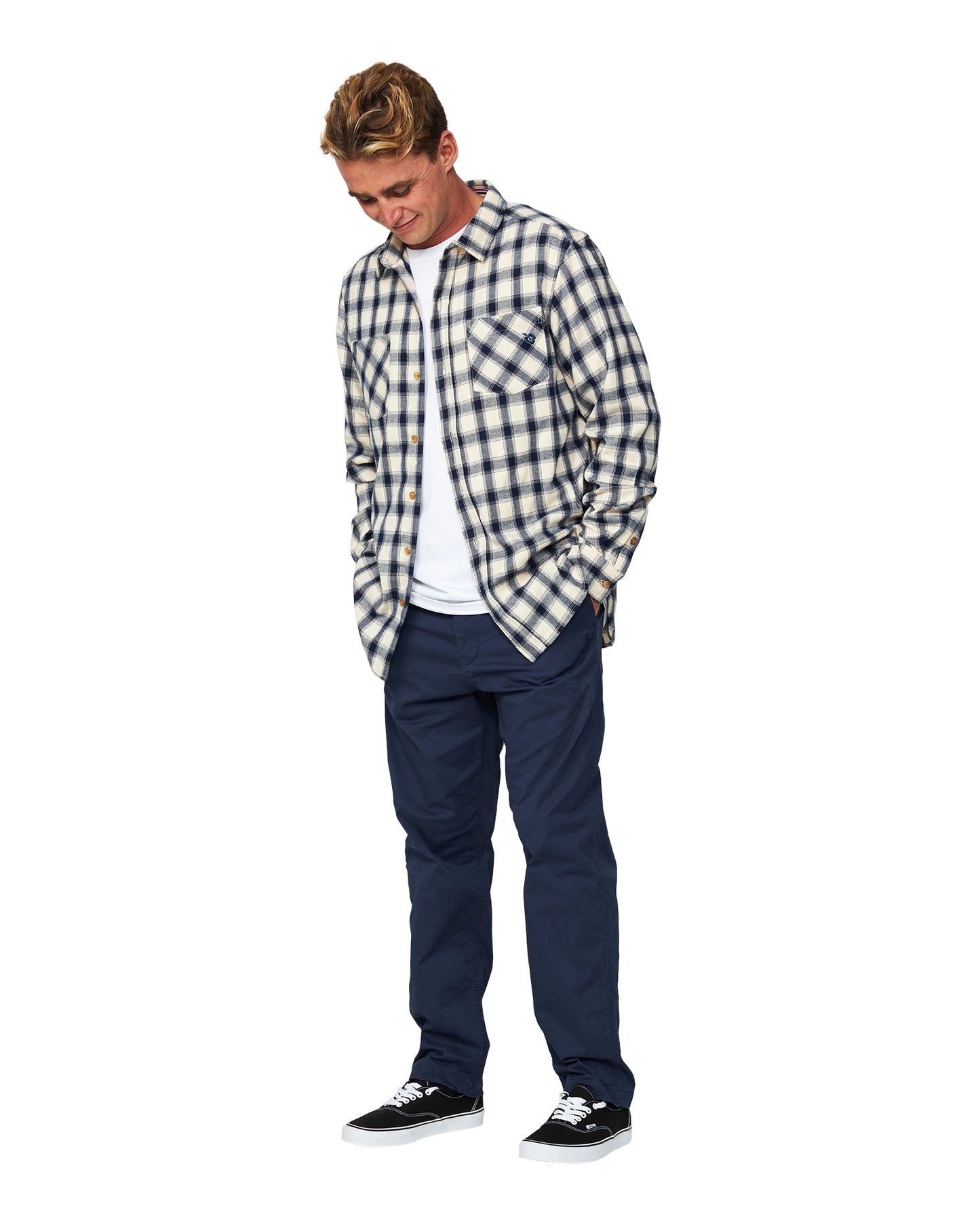 The Okanui Long Sleeve Flannel Shirt unbuttoned and worn over a white t-shirt.