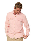 A male model posing candid wearing the Okanui Long Sleeve Deck Shirt in Dusty Pink color.
