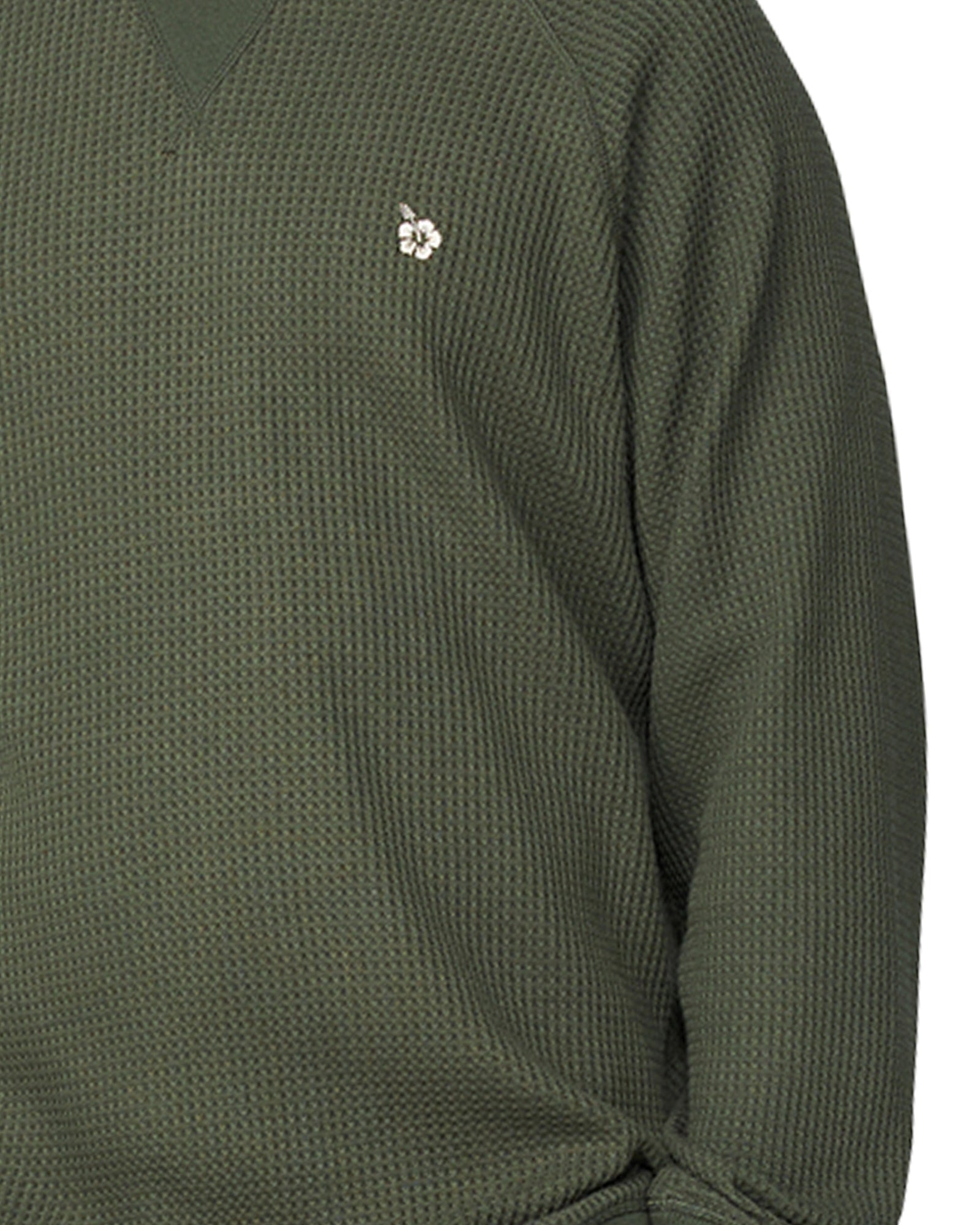 A close up view of the Okanui Waffle Jumper Crew featuring the Hibiscus logo of Okanui and the waffle patterns.