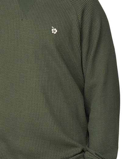 A close up view of the Okanui Waffle Jumper Crew featuring the Hibiscus logo of Okanui and the waffle patterns.