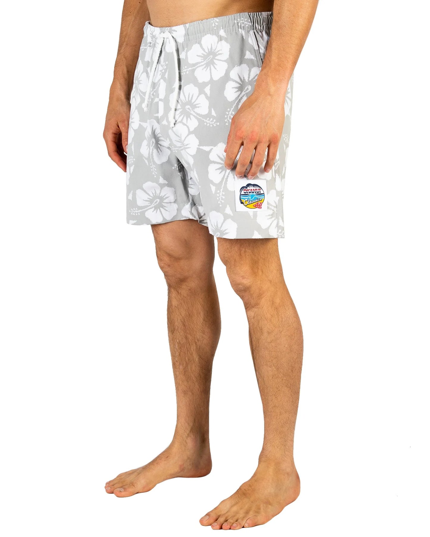 Mens classic short shorts with gray and white hibiscus flower showing the side pocket.