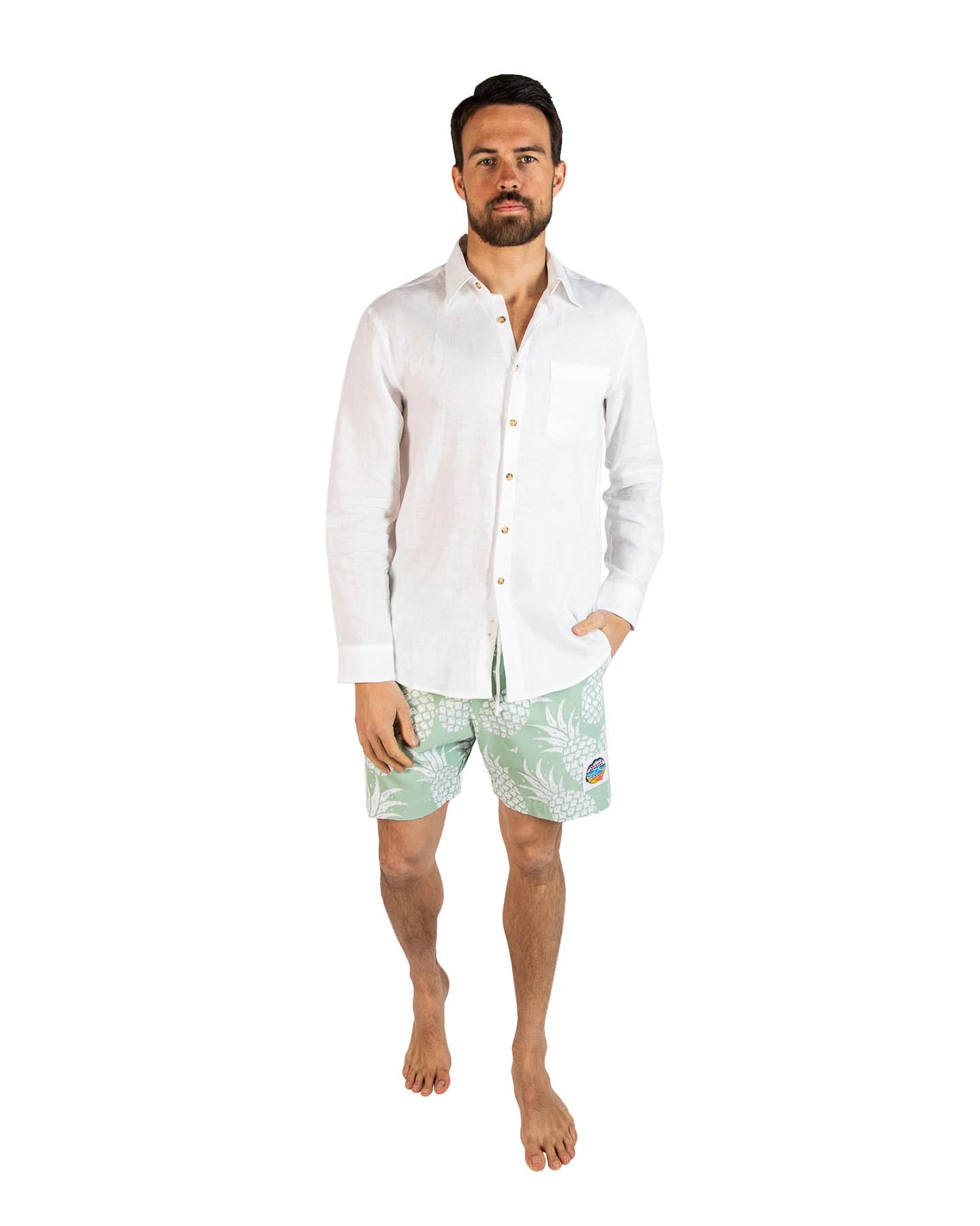 A classic men white and mint green color short shorts worn with a simple white top long sleeves.