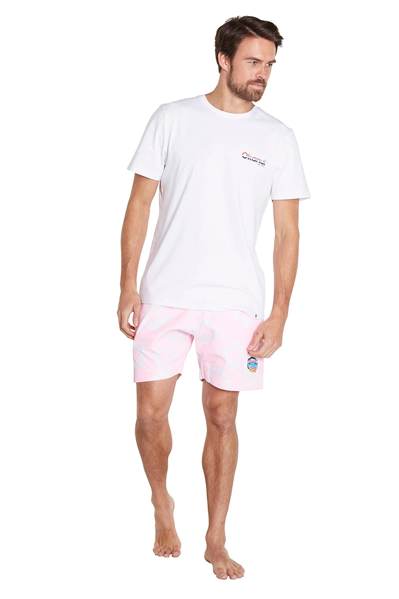 A classic men short shorts in color white and olive green worn with a simple white top shirt with the Okanui logo displayed in the left side.