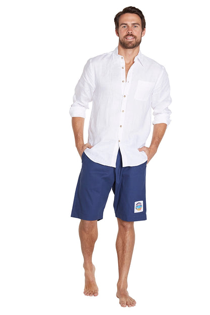 A man with a navy short on the bottom and a white long sleeve top.