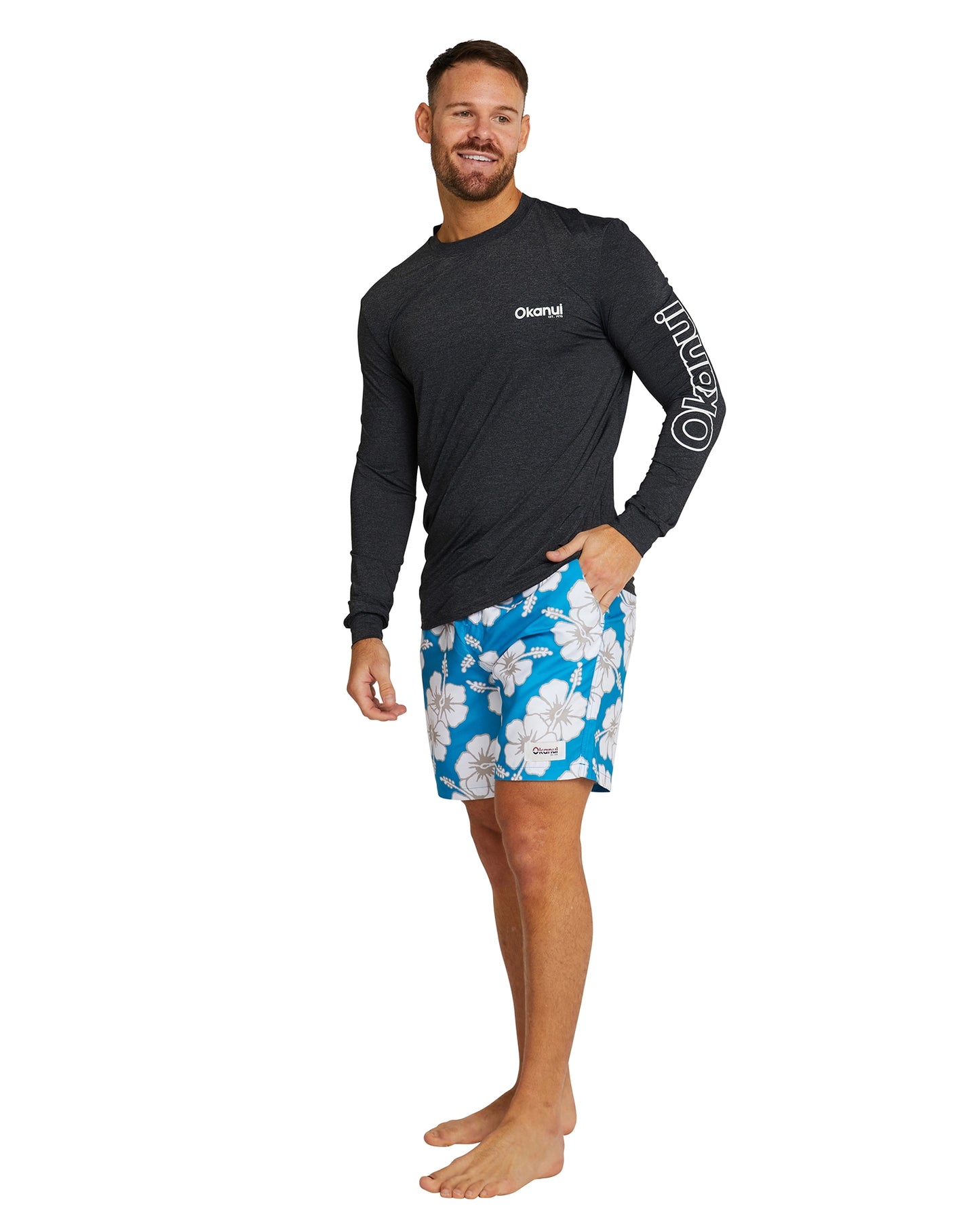 The Okanui Men's spring long sleeve rashie in black marle in right side view.