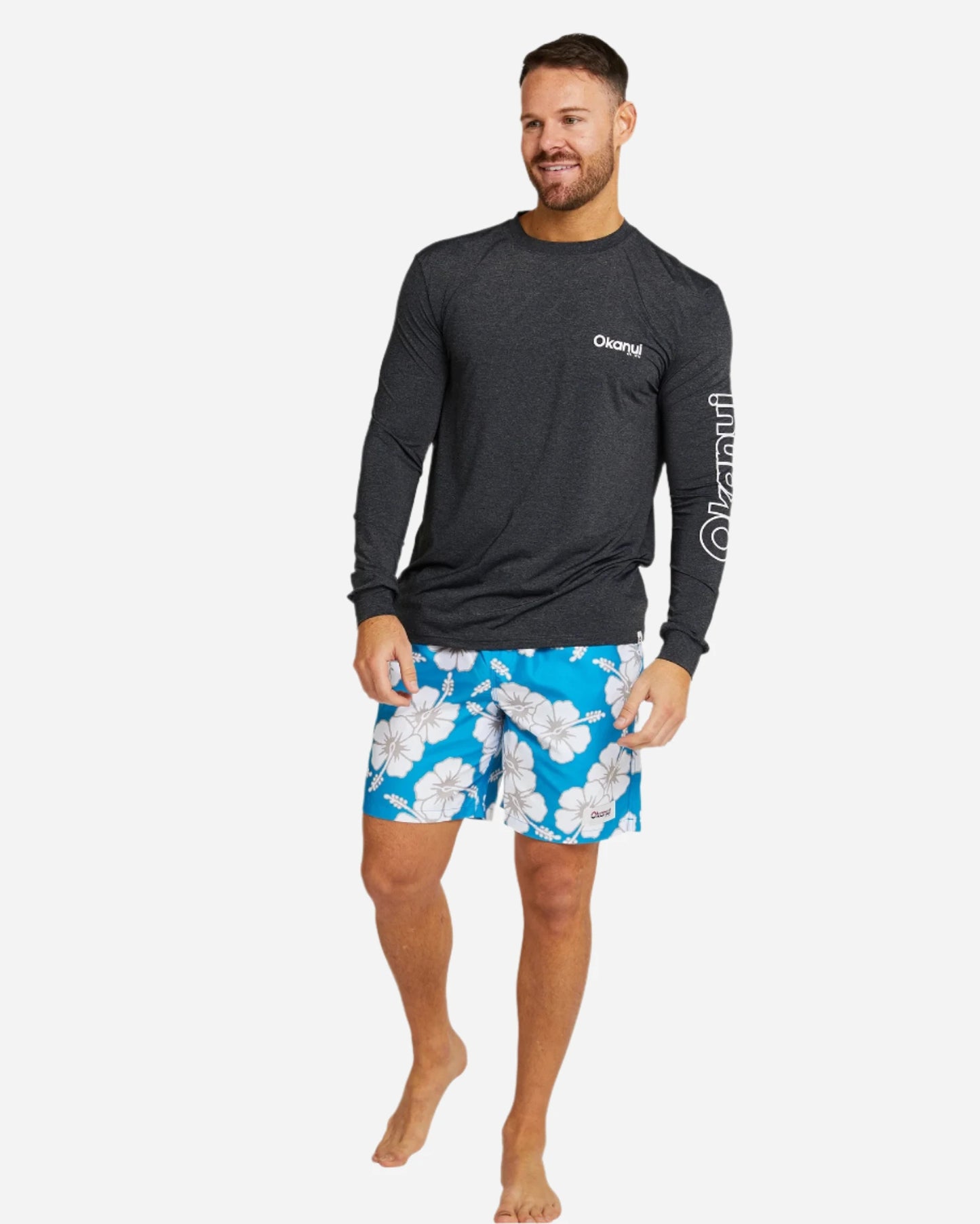 The Okanui Men's spring long sleeve rashie in black marle in full view.