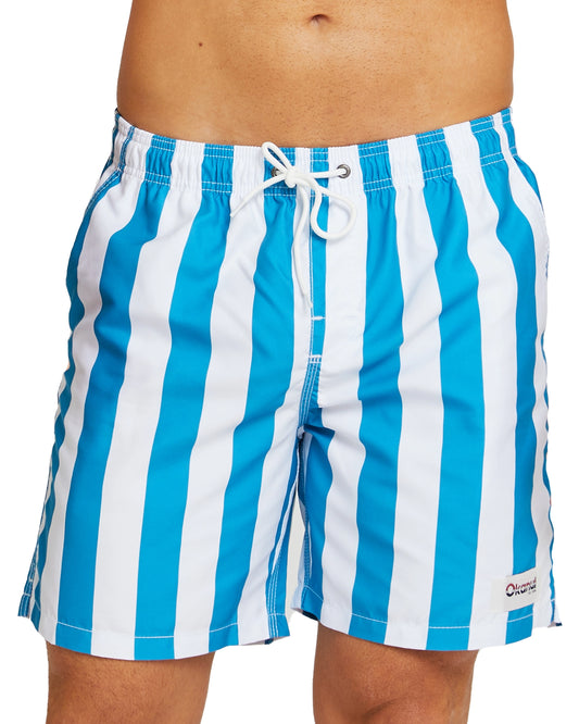 A close up view of the Okanui Classic Stripe Swim Shorts in Storm Blue color showcasing a white drawcord, elastic waist and light blue and white vertical stripes.